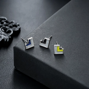 Three minimalist geometric triangle stud earrings with colored enamel and small zircon