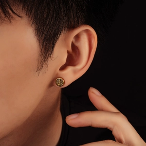 Vintage gold anchor stud earrings with nautical relief design and textured finish