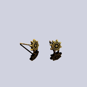 Retro golden ship wheel stud earrings with vintage floral design and sunburst pattern