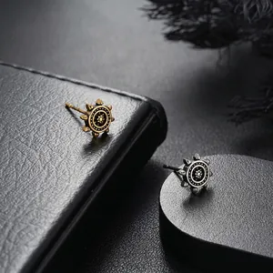 Retro ship wheel stud earrings in vintage gold and silver finishes for a punk style