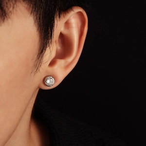 Moonstone stud earring in silver finish featuring a brilliant round-cut gemstone