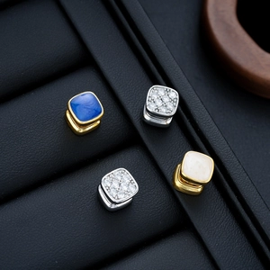 Set of four vintage square stud earrings with blue stones and crystals on black leather