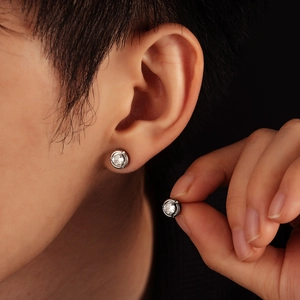 Minimalist moonstone stud earrings with silver claw setting and round clear gemstone