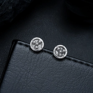 Boucles d'oreilles engrenage industriel vintage en argent au style steampunk