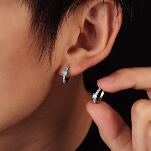 Silver hoop earrings with turquoise stones shown in a real wearing shot for sizing