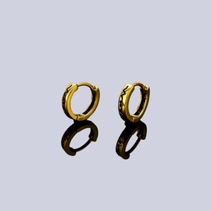 Elegant gold hoop earrings with black wave pattern and minimalist hinge clasp design