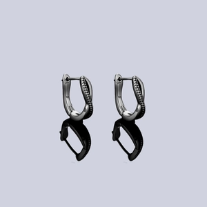 Polished stainless steel hoop earrings with snake skin texture on black mirror surface