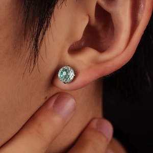 Four-prong mint green gemstone stud earring with classic brilliant cut for a stylish look