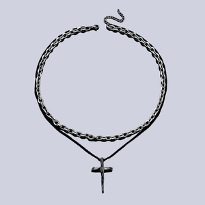 Double-layered silver chain and black cord necklace with geometric cross pendant