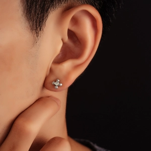 Flower moonstone stud earrings with vintage silver texture on model with black background