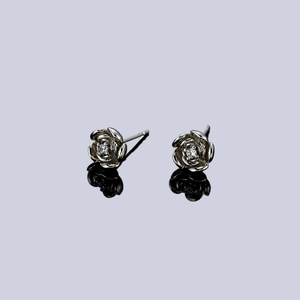 Exquisite 3D silver rose stud earrings with sparkling center zircon in a pair