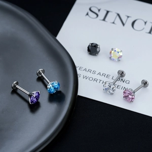 Flat back surgical steel studs with six colored cubic zirconia gems in four-prong setting