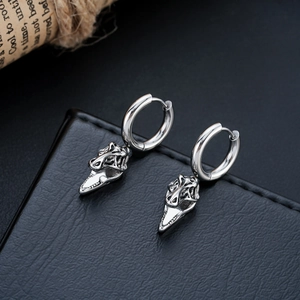 Vintage gothic T-Rex skull earrings in silver stainless steel with punk aesthetic