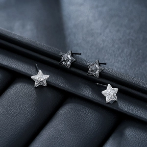 3D star stud earrings in black and silver with sparkling micro-pave zircon crystals