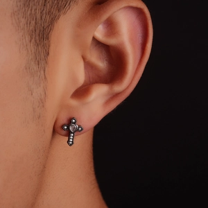 Gothic heart cross stud earring with white zircons and retro silver finish on male ear