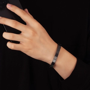Men's minimalist matte gunmetal square hematite beaded bracelet worn on wrist