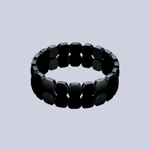 Minimalist black hematite beaded bracelet with polished square stones on a grey background
