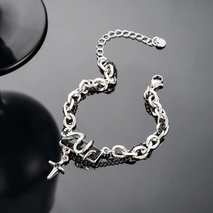Close-up of industrial punk chain bracelet with black SLP plaque and star charm