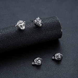 Retro zodiac monkey stud earrings in vintage silver finish with detailed engravings