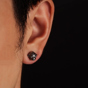 Monkey zodiac stud earring in black nickel finish for men and women on model