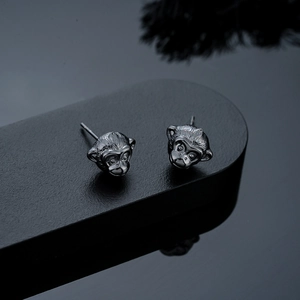 Detailed view of 3D monkey head stud earrings in gunmetal finish for men and women