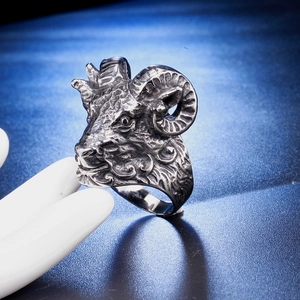Detailed close-up of vintage steel ram skull ring with intricate horn texture