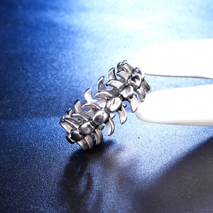 Detailed macro view of punk style silver steel ring with spine link chain texture