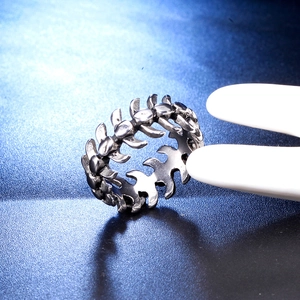 Retro stainless steel cross ring for men featuring a vintage mechanical spine structure