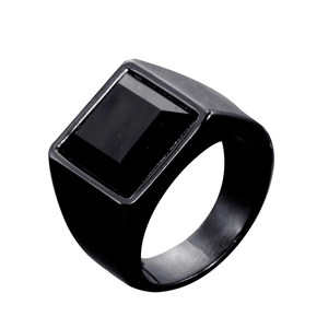 Polished black stainless steel men's ring with square black stone inlay on white background