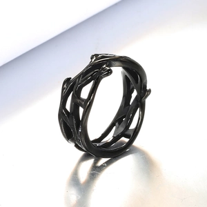 Macro shot of black stainless steel gothic ring with intricate branch hollow-out design
