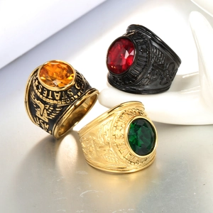 Detail showing American military style rings with colorful gems and eagle carvings