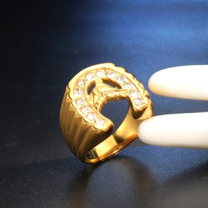Iced out horseshoe gold titanium steel ring with horse head motif and white zircons