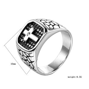 Detail view of men's stainless steel cross ring with square face and clear zircon stone