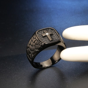 Men's black stainless steel signet ring with embossed cross and central crystal