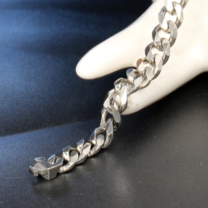 Polished stainless steel curb link bracelet for women with heavy metallic finish