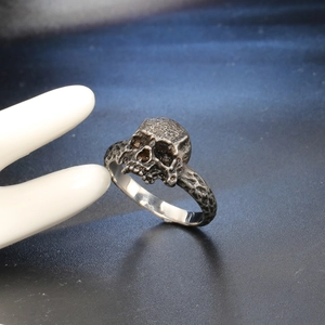 Vintage punk skull ring in retro oxidized stainless steel with rock textured band