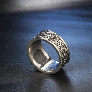 Mens vintage stainless steel ring featuring detailed celtic knot weave pattern in silver