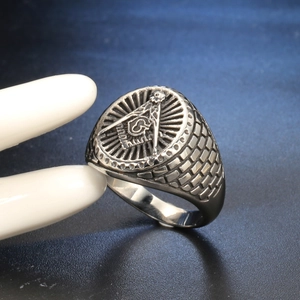Men's titanium steel Masonic ring with square and compass symbol on a hand model