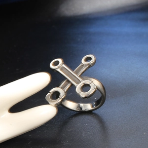 Mens stainless steel wrench and engine rod ring with cross mechanical industrial design