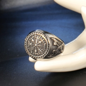 Vintage silver Viking Vegvisir compass ring with double axe carvings on a model hand