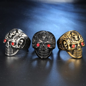 Punk skull rings with red crystal eyes in gold, silver, and black stainless steel finish