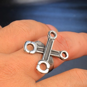 Punk style men's stainless steel ring featuring unique crossed engine piston rods