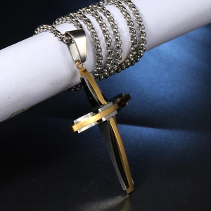Detailed view of hip hop stainless steel cross pendant in gold and silver finish