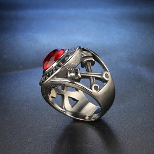 Retro stainless steel motorcycle ring with large red gemstone and mechanical piston detail