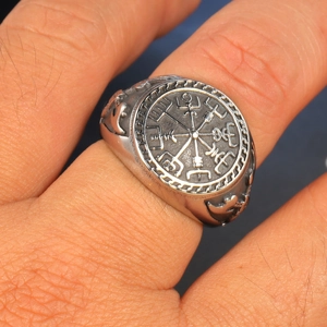 Close-up of vintage stainless steel Viking Vegvisir compass ring with silver finish