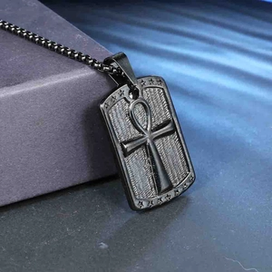 Detail of black Ankh cross dog tag pendant with engraved stars and round bead chain neckwear