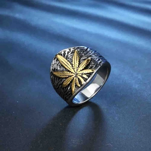 Retro stainless steel ring for men featuring golden maple leaf on dark oxidized metal base