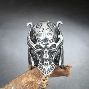 Gothic stainless steel skull helmet ring for men with vintage silver finish on wood
