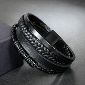 Men's multilayer black braided leather bracelet with magnetic clasp on a black gift box