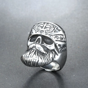 Detailed view of a vintage stainless steel skull ring with intricate beard carvings